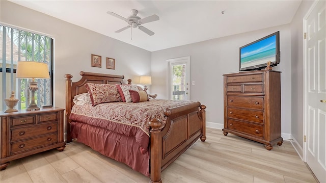bedroom with light wood finished floors, access to outside, baseboards, and a ceiling fan