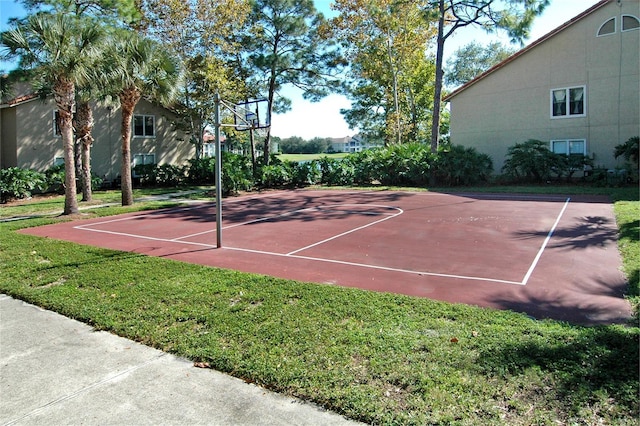 view of sport court featuring a yard and community basketball court