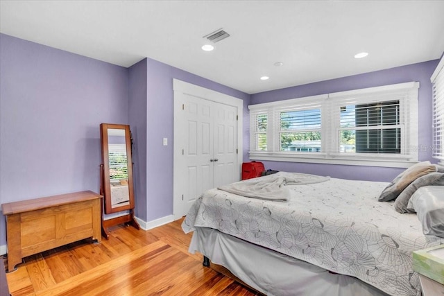 5012 Eastchester Dr, Sarasota, FL 34234 - bedroom featuring light wood-style floors, recessed lighting, baseboards, visible vents, and a closet