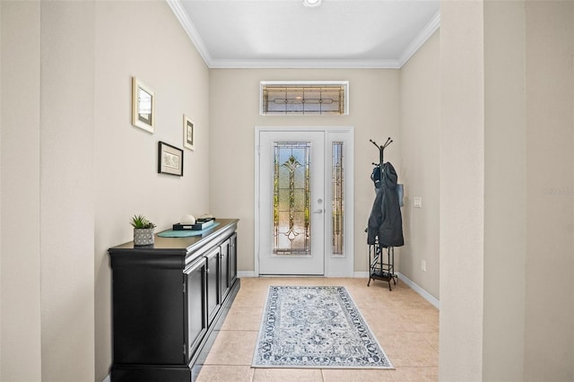 entryway featuring crown molding, baseboards, and light tile patterned floors