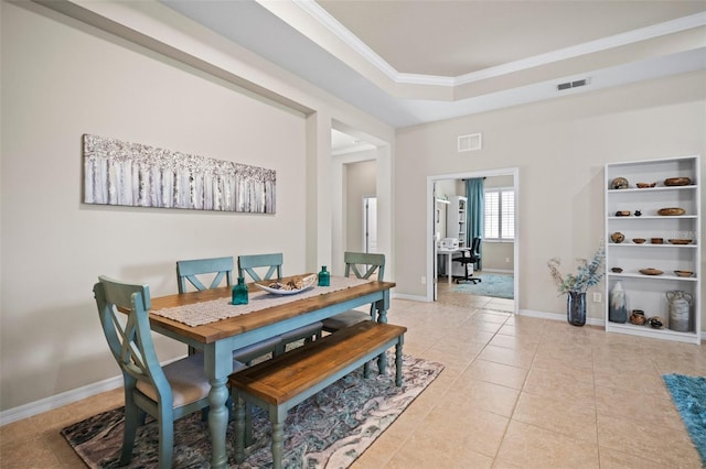 dining area featuring crown molding, baseboards, light tile patterned floors, and visible vents