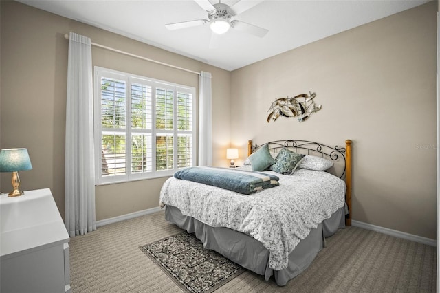 carpeted bedroom with baseboards and ceiling fan