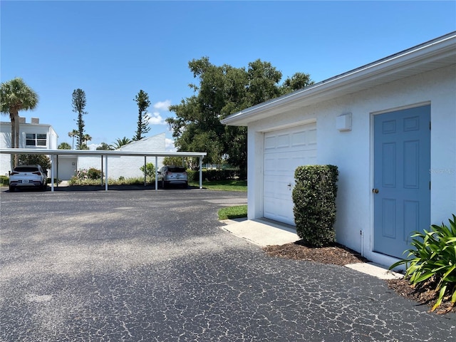 garage with a carport