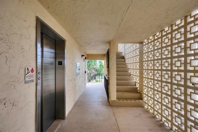 2280 Stickney Point Rd Unit 420, Sarasota, FL 34231 - hallway featuring elevator