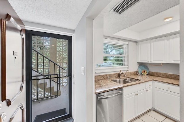 2280 Stickney Point Rd Unit 420, Sarasota, FL 34231 - kitchen featuring visible vents, stainless steel dishwasher, light stone countertops, a sink, and white cabinetry
