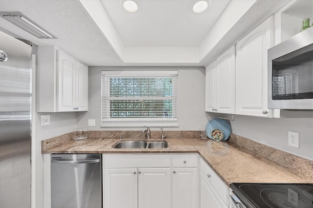 2280 Stickney Point Rd Unit 420, Sarasota, FL 34231 - kitchen with a sink, white cabinets, and stainless steel appliances