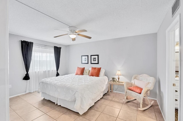 2280 Stickney Point Rd Unit 420, Sarasota, FL 34231 - bedroom featuring light tile patterned flooring, a textured ceiling, visible vents, and ceiling fan