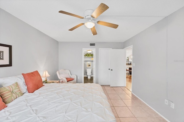 2280 Stickney Point Rd Unit 420, Sarasota, FL 34231 - bedroom with light tile patterned flooring, ceiling fan, visible vents, and ensuite bath