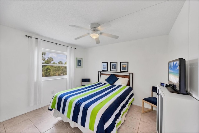 2280 Stickney Point Rd Unit 420, Sarasota, FL 34231 - tiled bedroom with a ceiling fan and a textured ceiling