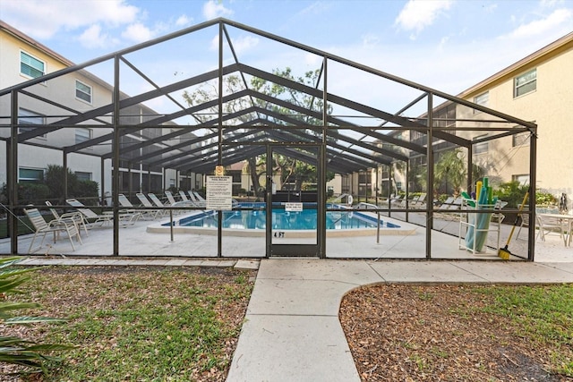 2280 Stickney Point Rd Unit 420, Sarasota, FL 34231 - pool featuring glass enclosure and a patio area
