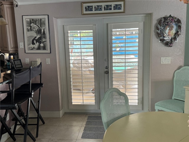 652 N Elm St, Englewood, FL 34223 - doorway to outside featuring light tile patterned floors, baseboards, and french doors