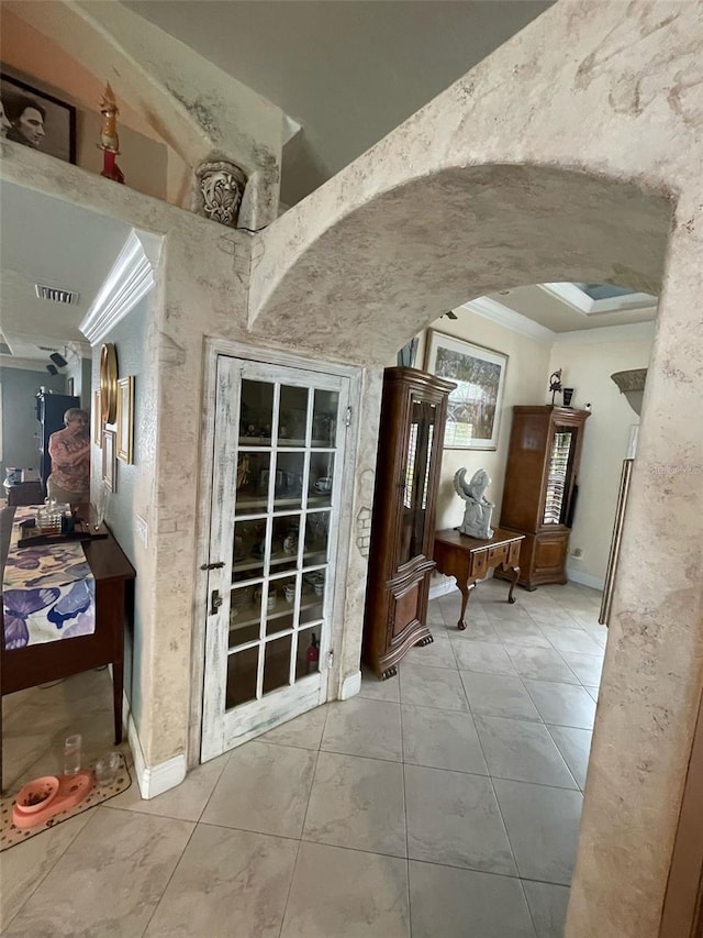 652 N Elm St, Englewood, FL 34223 - hallway featuring arched walkways, ornamental molding, and baseboards