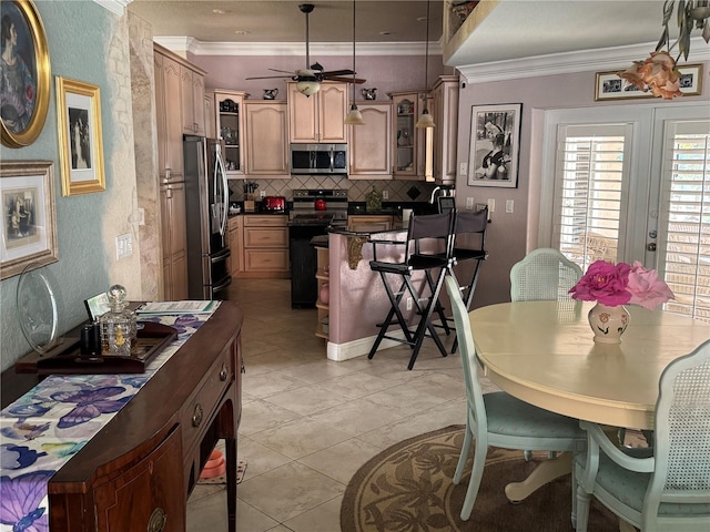 652 N Elm St, Englewood, FL 34223 - dining area featuring a ceiling fan, ornamental molding, and light tile patterned flooring