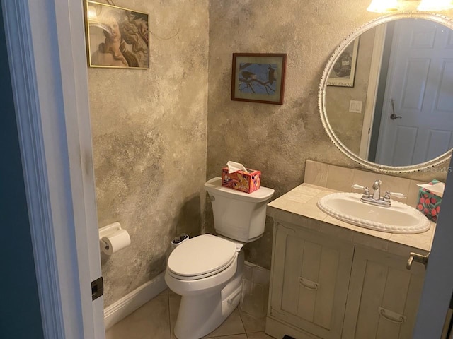 652 N Elm St, Englewood, FL 34223 - bathroom with toilet, vanity, tile patterned floors, and a textured wall