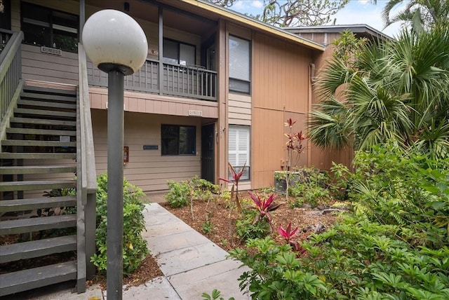 view of property featuring stairway