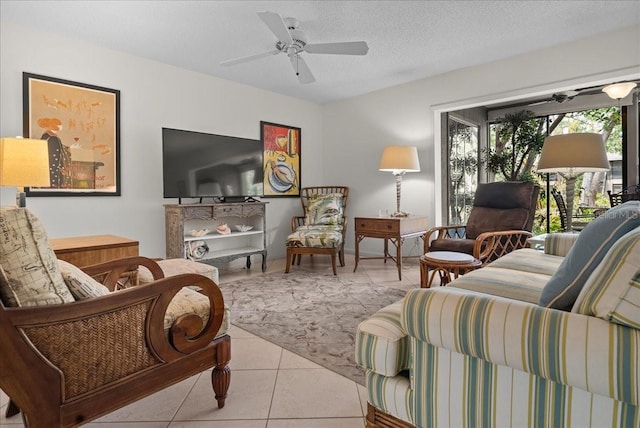 tiled living room featuring a ceiling fan