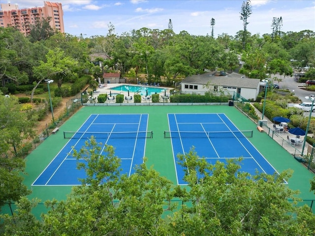 view of sport court with fence
