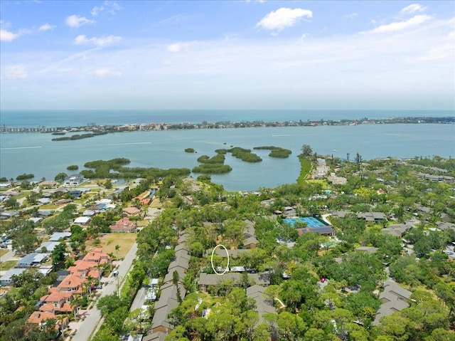drone / aerial view with a water view and a residential view