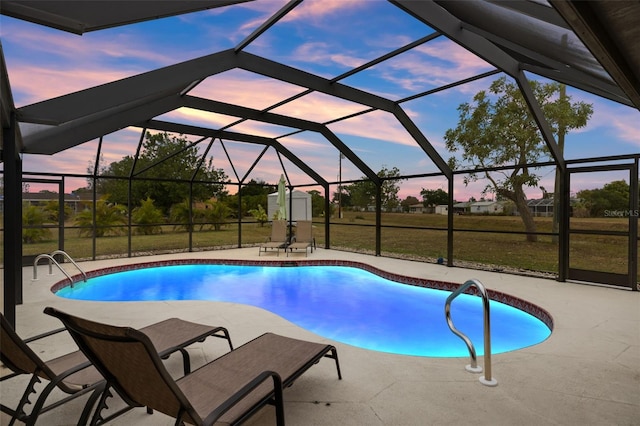 1458 Alwynne Dr N, Lehigh Acres, FL 33936 - pool featuring a patio, glass enclosure, and a lawn