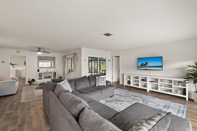 1458 Alwynne Dr N, Lehigh Acres, FL 33936 - living room with visible vents, a ceiling fan, wood finished floors, and a wealth of natural light