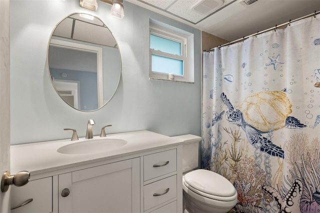 1458 Alwynne Dr N, Lehigh Acres, FL 33936 - bathroom featuring vanity, visible vents, toilet, and a shower with curtain