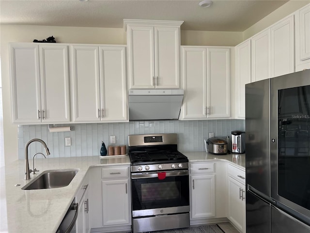 5521 Summit Gln, Bradenton, FL 34203 - kitchen with smart refrigerator, stainless steel range with gas cooktop, a sink, exhaust hood, and white cabinetry