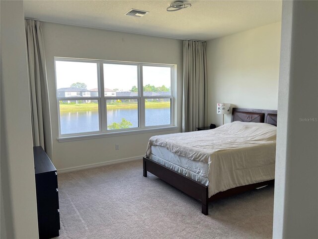 5521 Summit Gln, Bradenton, FL 34203 - bedroom with carpet, baseboards, and a water view
