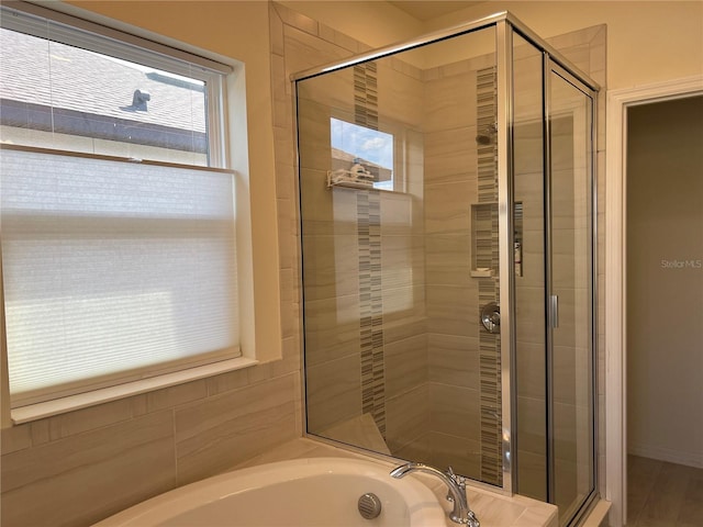 5521 Summit Gln, Bradenton, FL 34203 - bathroom with a stall shower and a garden tub