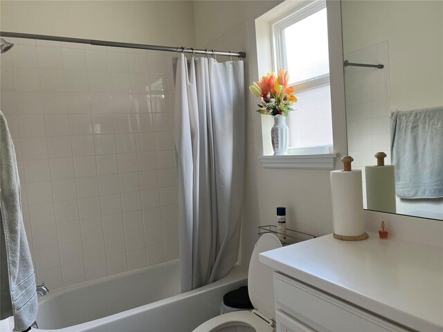 5521 Summit Gln, Bradenton, FL 34203 - full bathroom with healthy amount of natural light, shower / bath combo with shower curtain, vanity, and toilet