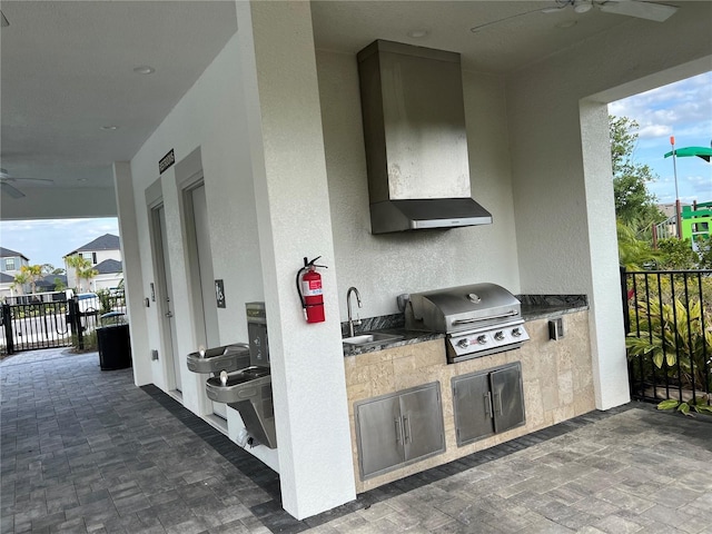 5521 Summit Gln, Bradenton, FL 34203 - view of patio with a grill, ceiling fan, and exterior kitchen
