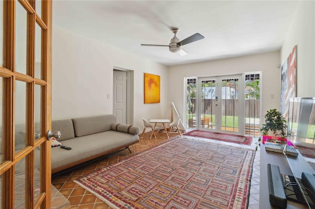 living area featuring a ceiling fan, french doors, and tile patterned flooring