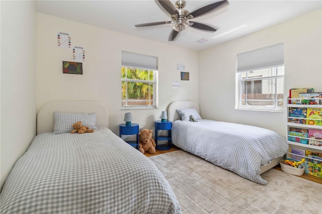 bedroom with a ceiling fan and visible vents