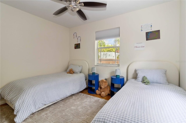 bedroom featuring a ceiling fan and light wood-type flooring