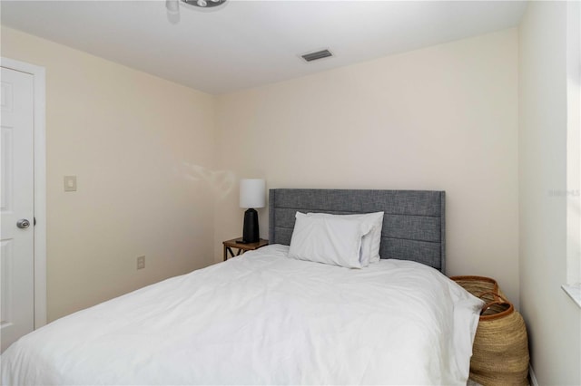 bedroom featuring visible vents
