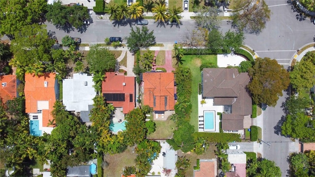 birds eye view of property with a residential view