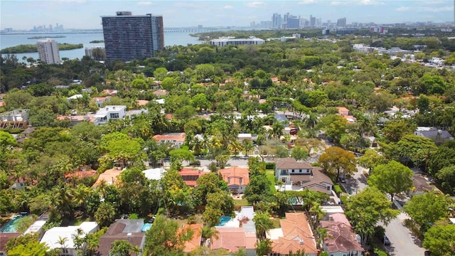 birds eye view of property with a city view and a water view