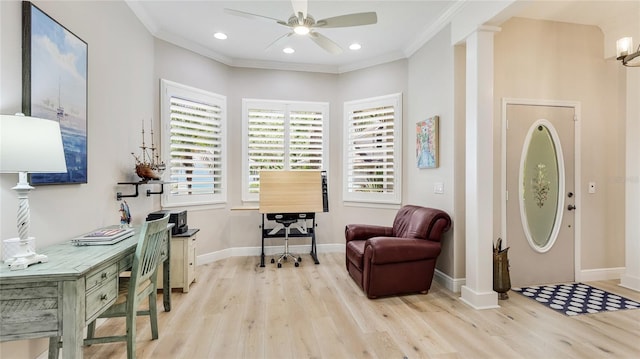 entrance foyer featuring a ceiling fan, ornamental molding, baseboards, and wood finished floors