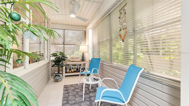 sunroom with a ceiling fan