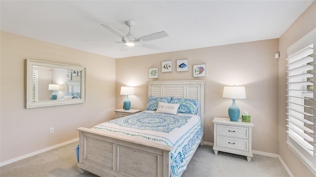 bedroom with baseboards, light carpet, and a ceiling fan