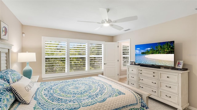 bedroom featuring visible vents, baseboards, and ceiling fan