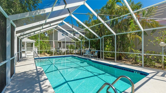 outdoor pool featuring a patio and a lanai