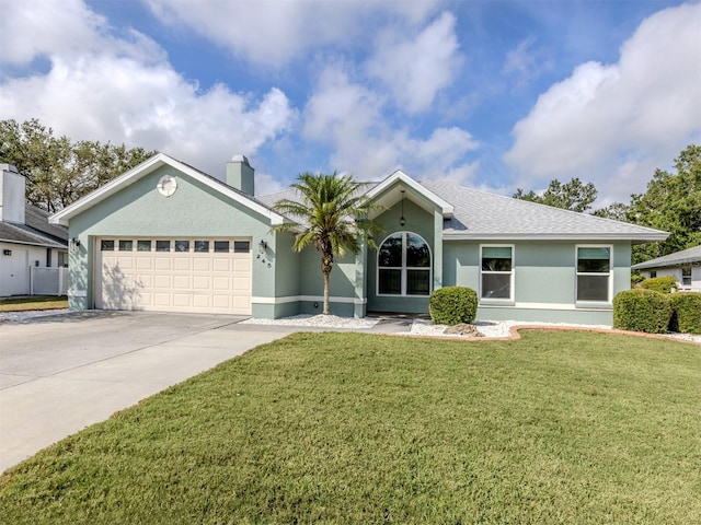 245 Woodingham Trl, Venice, FL 34292 - ranch-style house with an attached garage, concrete driveway, stucco siding, a front lawn, and a chimney