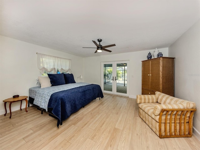 245 Woodingham Trl, Venice, FL 34292 - bedroom featuring access to outside, french doors, light wood-style floors, and baseboards