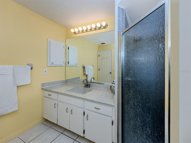 245 Woodingham Trl, Venice, FL 34292 - full bath with tile patterned flooring, a stall shower, baseboards, and vanity