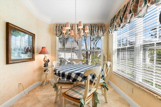dining area with baseboards, ornamental molding, and a chandelier