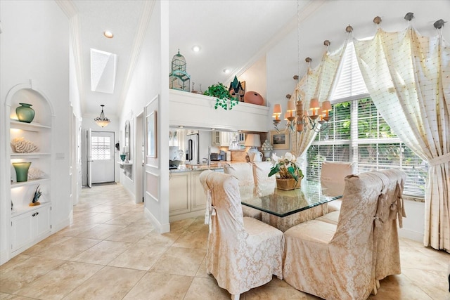 dining room featuring ornamental molding, built in features, light tile patterned flooring, high vaulted ceiling, and a chandelier