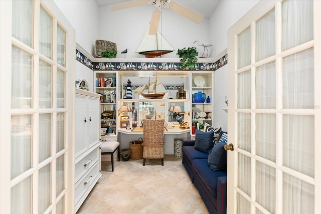 interior space with ceiling fan, french doors, and tile patterned flooring