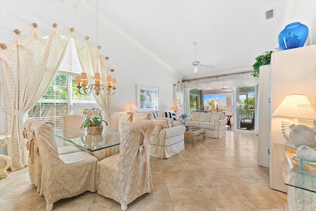 dining area with visible vents, crown molding, ceiling fan with notable chandelier, and a wealth of natural light