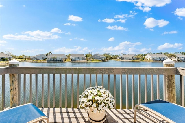 exterior space featuring a water view and a residential view