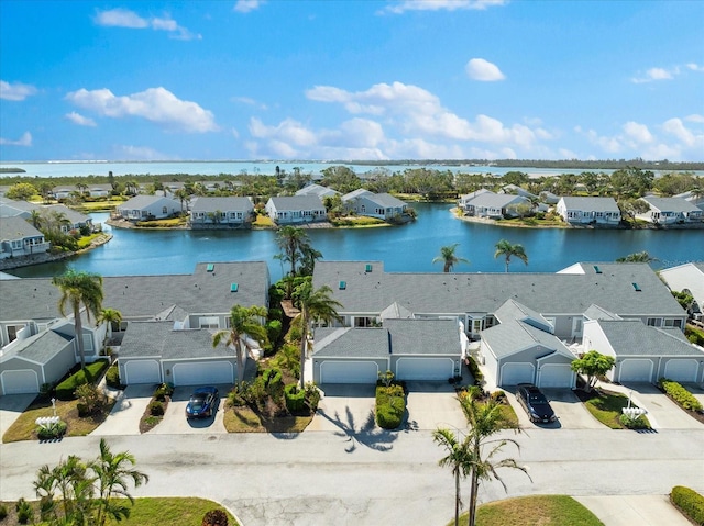 aerial view with a residential view and a water view